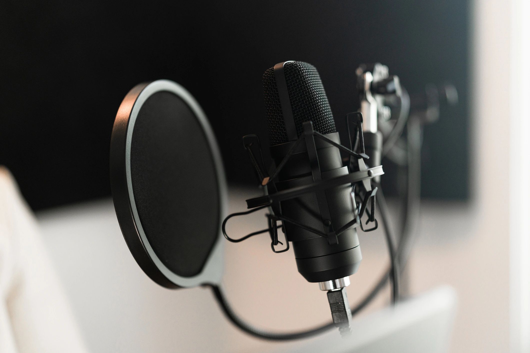 Person recording audio teaching with a microphone