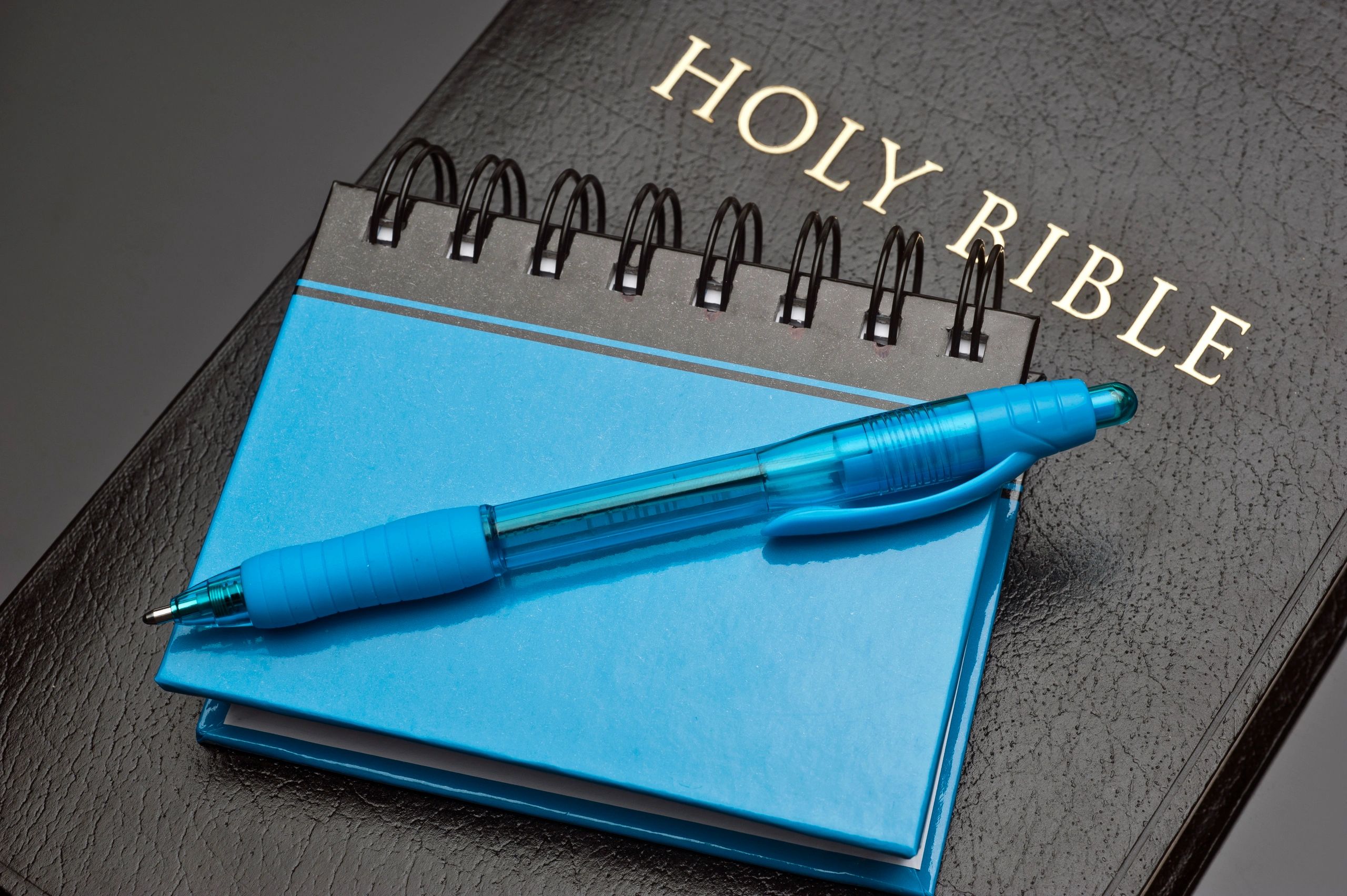 Notebook, pen, and Bible for study notes